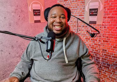 Eric LeGrand takes a photo inside the studio where he films A Cup of bELieve Podcast.