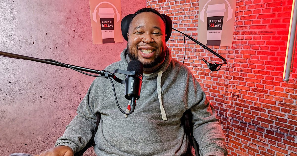 Eric LeGrand takes a photo inside the studio where he films A Cup of bELieve Podcast.
