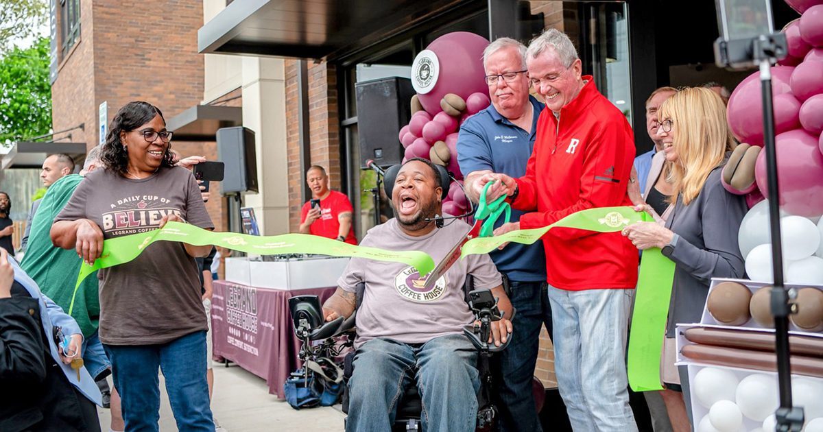 New Jersey Governor Phil Murphy and Woodbrdge Mayor John McCormac do a ribbon cutting with Eric LeGrand and Karen LeGrand at the grand opening of LeGrand Coffee House.